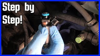 How to Replace a Fuel Injector Ford F150 20042008 [upl. by Ialokin]