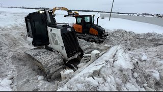 CAT D3 VS DOOSAN DD100  DOZERS PUSHING SNOW  ZieglerCAT DEVELONNorthAmerica [upl. by Hsirahc55]